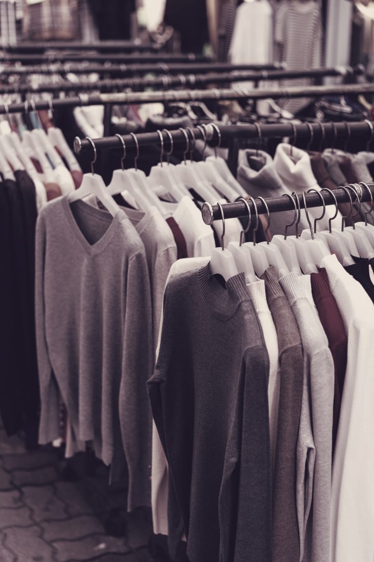 Knitwear on hangers — part of our women's and men's apparel lots